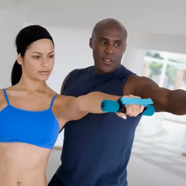 A man and woman are doing exercises together.